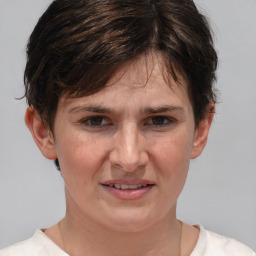 Joyful white adult female with short  brown hair and brown eyes