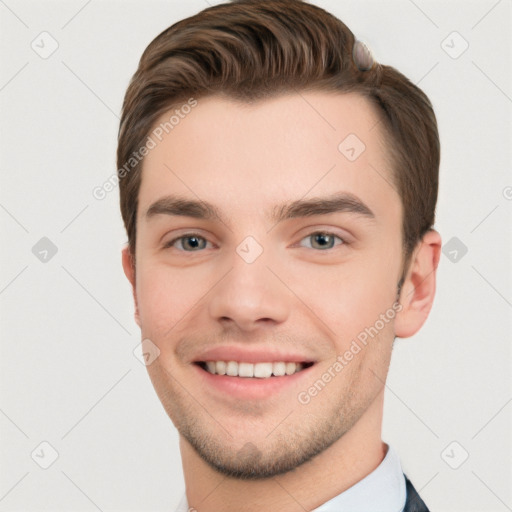 Joyful white young-adult male with short  brown hair and grey eyes