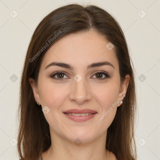 Joyful white young-adult female with long  brown hair and brown eyes