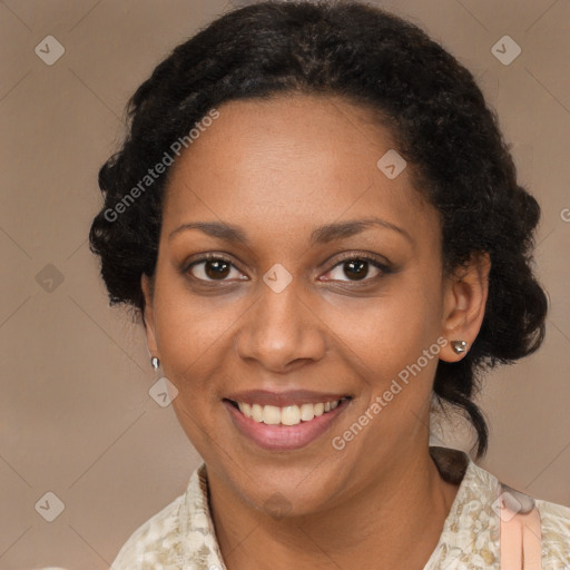 Joyful black adult female with medium  black hair and brown eyes