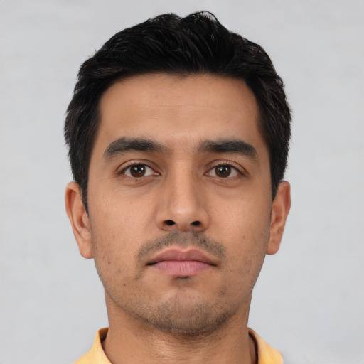 Neutral latino young-adult male with short  black hair and brown eyes