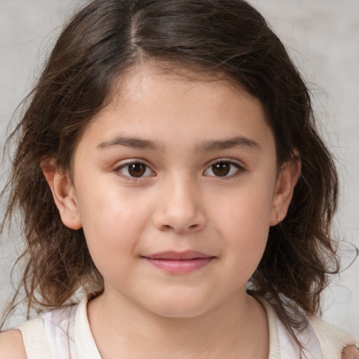 Joyful white child female with medium  brown hair and brown eyes