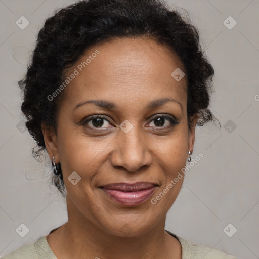 Joyful black adult female with short  brown hair and brown eyes