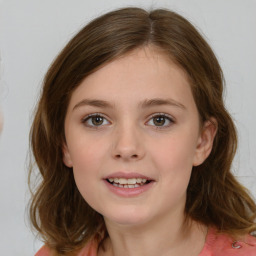 Joyful white child female with medium  brown hair and brown eyes