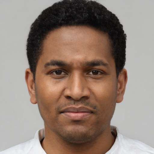 Neutral latino young-adult male with short  brown hair and brown eyes