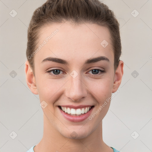 Joyful white young-adult female with short  brown hair and grey eyes