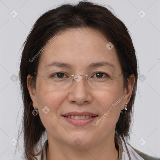 Joyful white adult female with medium  brown hair and brown eyes