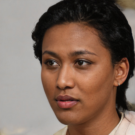 Neutral latino young-adult female with short  black hair and brown eyes