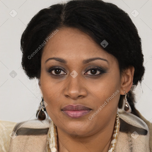 Joyful black adult female with short  brown hair and brown eyes