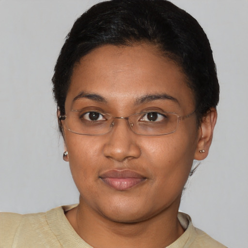 Joyful asian young-adult female with short  black hair and brown eyes