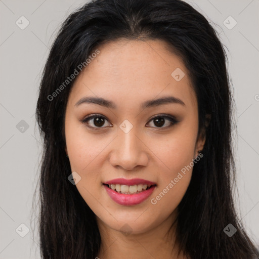 Joyful asian young-adult female with long  brown hair and brown eyes