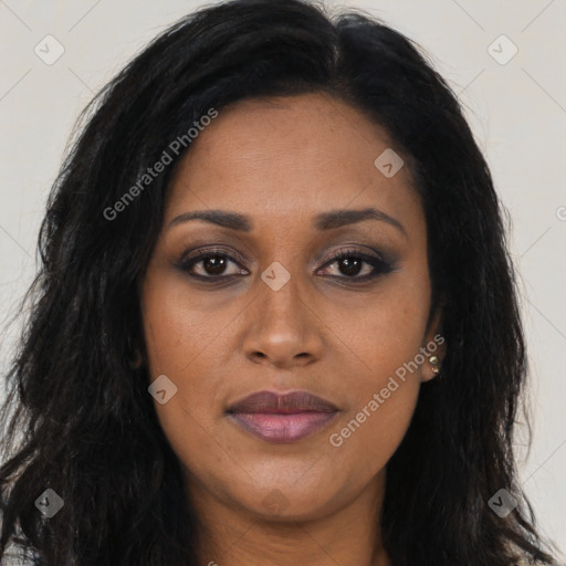 Joyful black young-adult female with long  brown hair and brown eyes