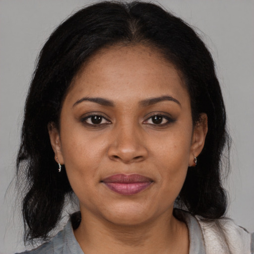 Joyful asian young-adult female with medium  black hair and brown eyes