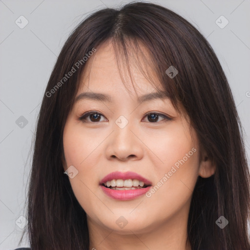 Joyful asian young-adult female with long  brown hair and brown eyes