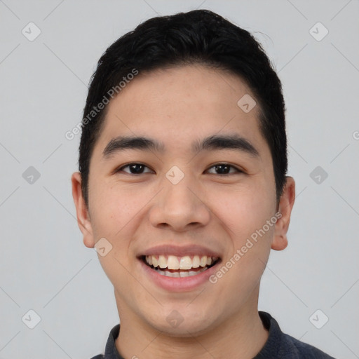 Joyful asian young-adult male with short  black hair and brown eyes