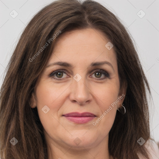 Joyful white adult female with long  brown hair and grey eyes