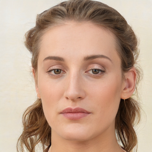 Joyful white young-adult female with medium  brown hair and blue eyes