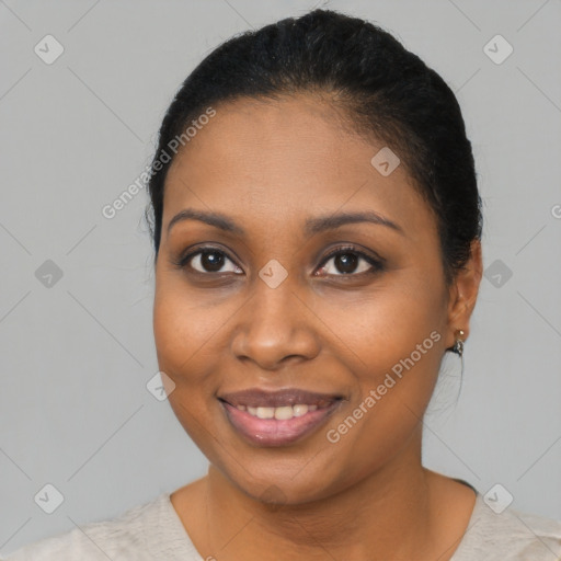 Joyful black young-adult female with medium  brown hair and brown eyes