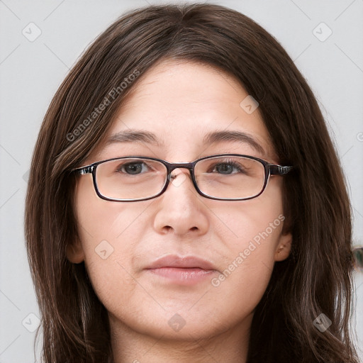 Neutral white young-adult female with long  brown hair and brown eyes