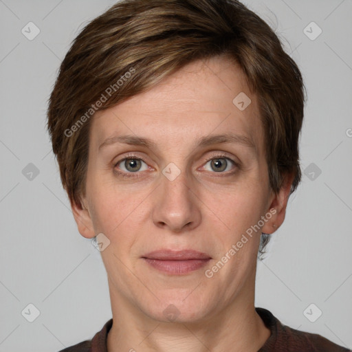 Joyful white adult female with short  brown hair and grey eyes