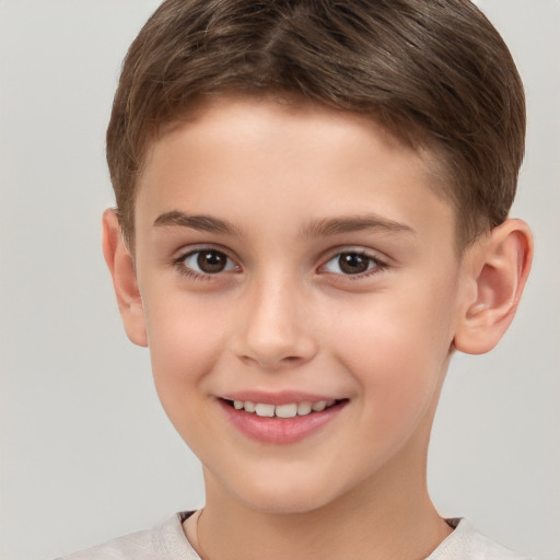 Joyful white child male with short  brown hair and brown eyes