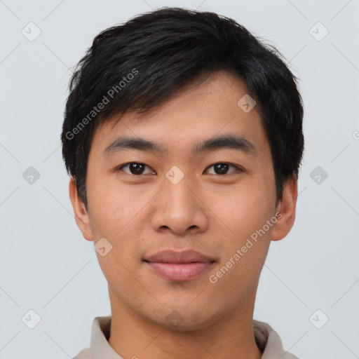 Joyful asian young-adult male with short  black hair and brown eyes