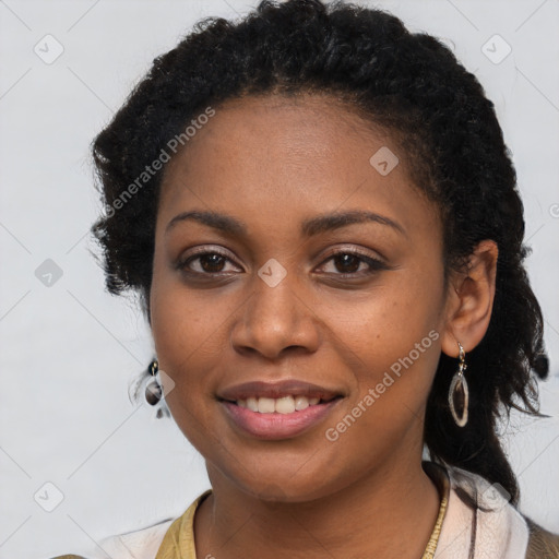 Joyful black young-adult female with long  brown hair and brown eyes