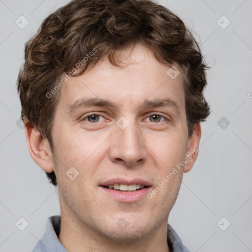 Joyful white adult male with short  brown hair and grey eyes