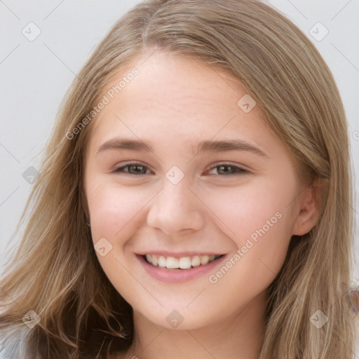 Joyful white child female with long  brown hair and brown eyes