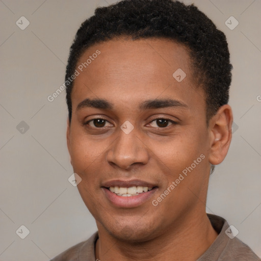 Joyful black young-adult male with short  brown hair and brown eyes