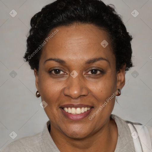 Joyful black adult female with short  brown hair and brown eyes