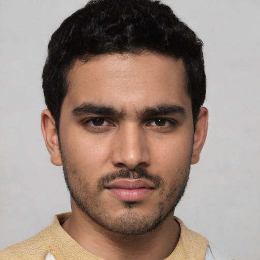 Neutral latino young-adult male with short  black hair and brown eyes