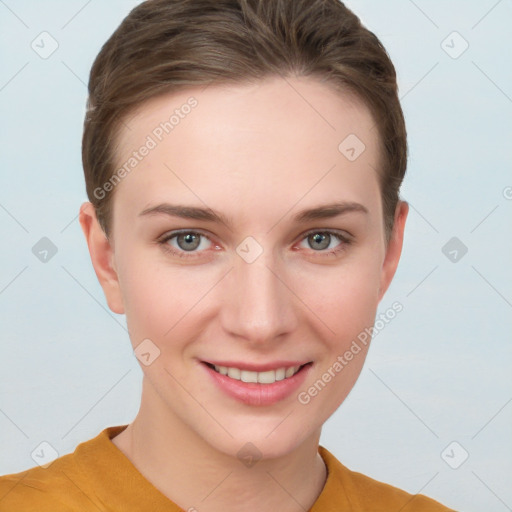 Joyful white young-adult female with short  brown hair and grey eyes