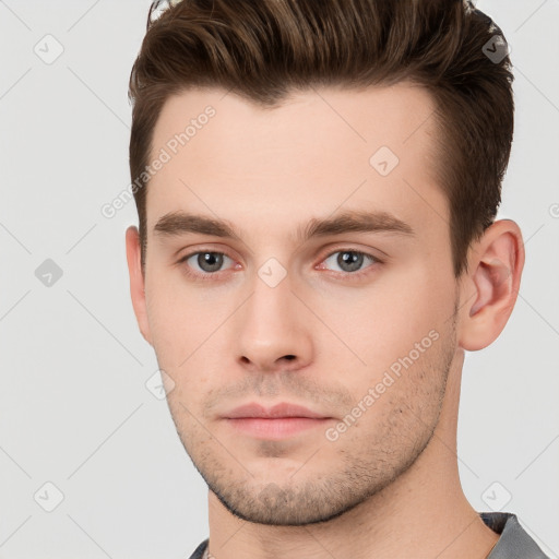 Neutral white young-adult male with short  brown hair and brown eyes