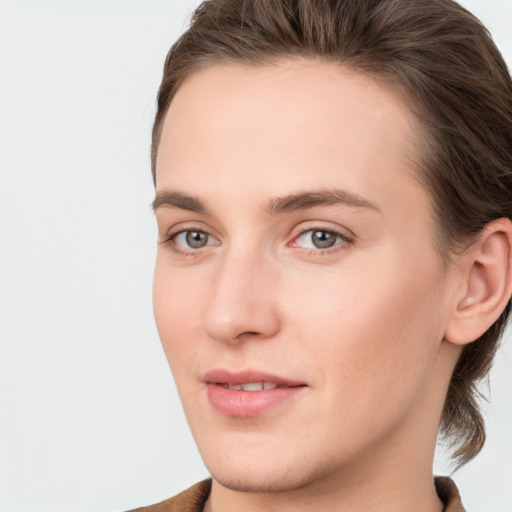 Joyful white young-adult female with medium  brown hair and grey eyes