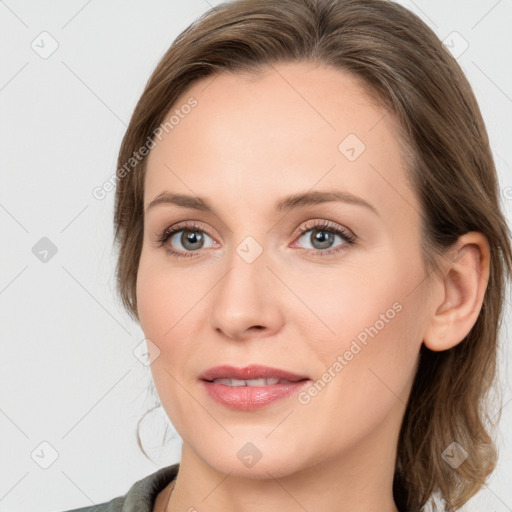 Joyful white young-adult female with medium  brown hair and blue eyes