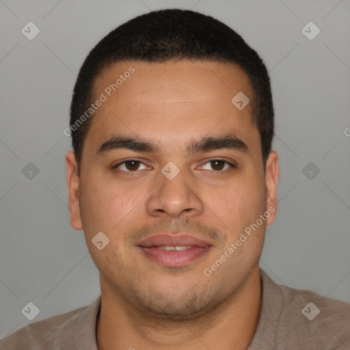 Joyful latino young-adult male with short  brown hair and brown eyes