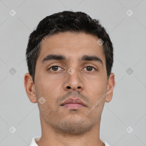 Neutral latino young-adult male with short  black hair and brown eyes