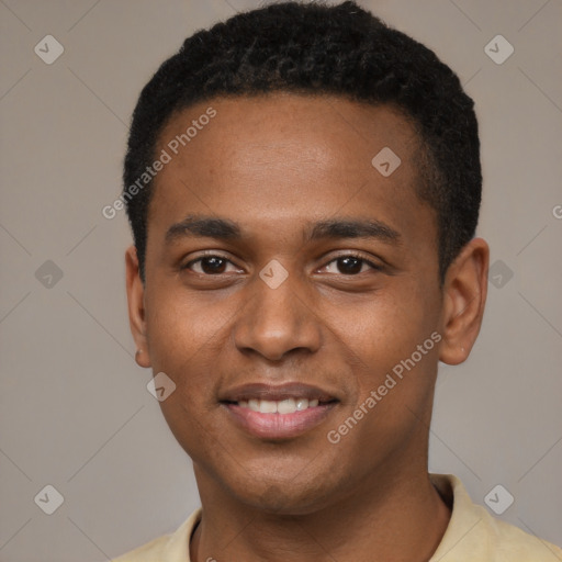 Joyful black young-adult male with short  brown hair and brown eyes