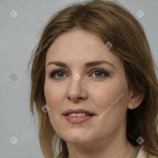 Joyful white adult female with medium  brown hair and grey eyes