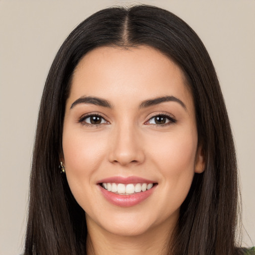 Joyful white young-adult female with long  black hair and brown eyes