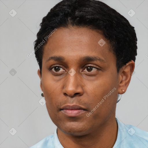 Neutral latino young-adult male with short  black hair and brown eyes