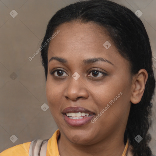 Joyful black young-adult female with long  brown hair and brown eyes