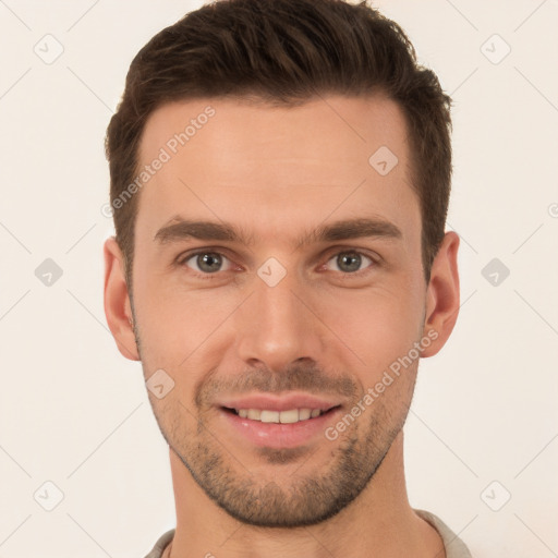 Joyful white young-adult male with short  brown hair and brown eyes