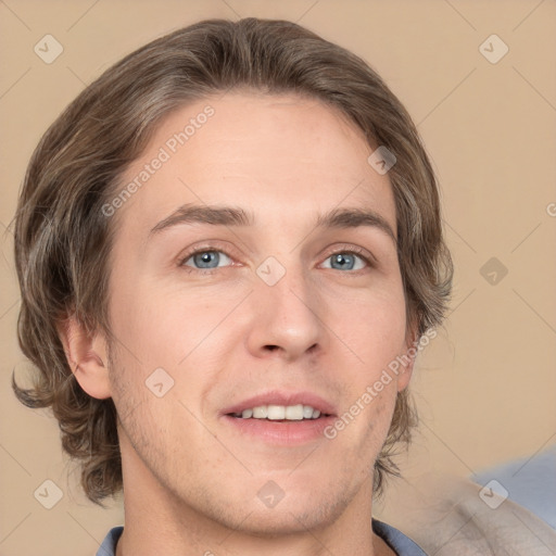 Joyful white young-adult male with medium  brown hair and grey eyes