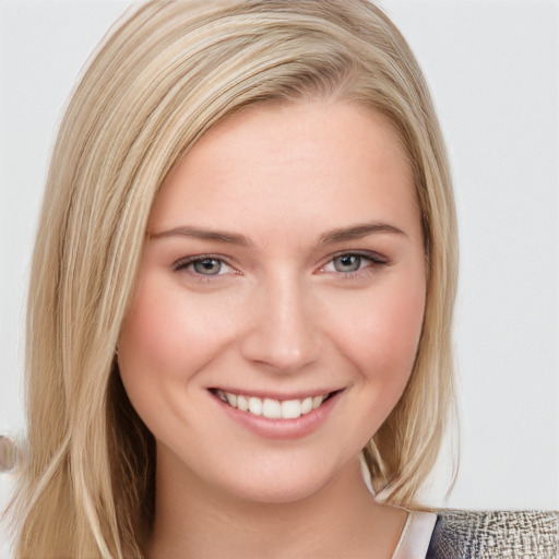 Joyful white young-adult female with medium  brown hair and blue eyes