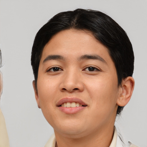 Joyful asian young-adult female with short  brown hair and brown eyes