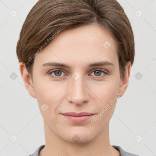 Joyful white young-adult female with short  brown hair and grey eyes