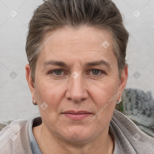 Joyful white adult female with short  brown hair and brown eyes