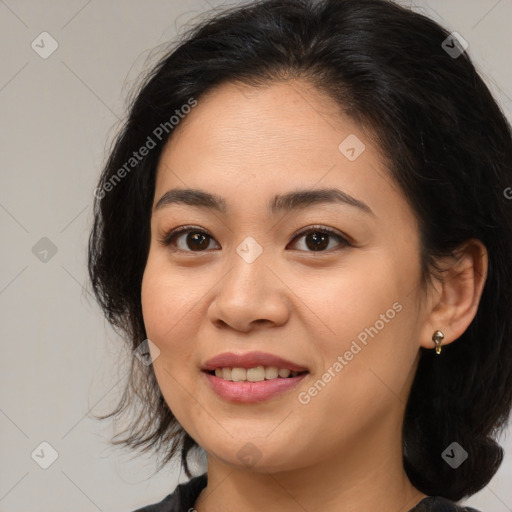 Joyful asian young-adult female with medium  brown hair and brown eyes